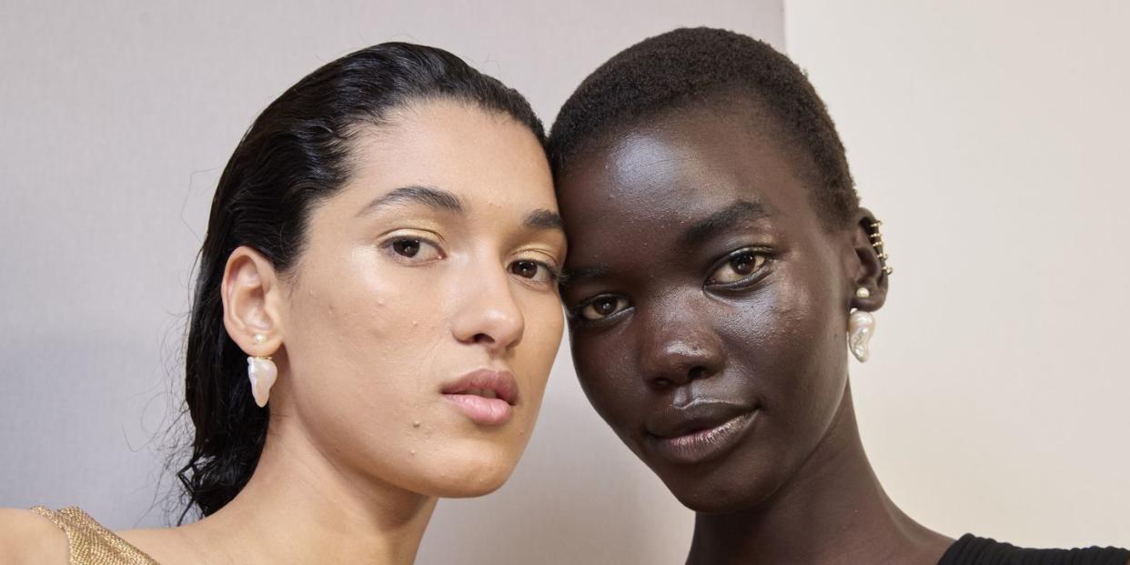 a couple of women posing for the camera