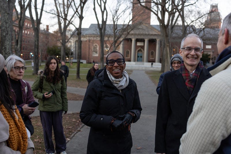 CAMBRIDGE, MA - DECEMBER 13: Harvard President Claudine Gay (C) attends a menorah lighting ceremony on the seventh night of Hanukkah with the University’s Jewish community on December 13, 2023, in Harvard Yard, Cambridge, Massachusetts. The Harvard trustees voted to keep President Gay after she responded to a Congressional hearing with an answer to a question about hate speech on campus.