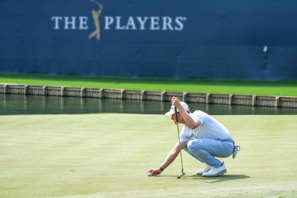 Ben Griffin places the ball on the 18th green during the second round of The Players Championship on March 10. The PGA Tour rookie has risen to 77th in the world and will compete in the WGC-Dell Technologies Match Play for the first time this week.