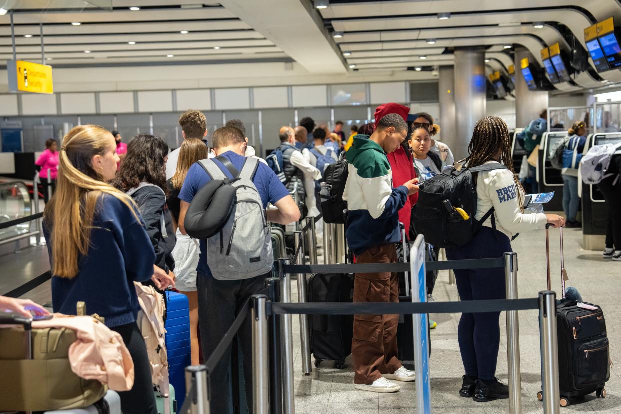 People queue to check in at Heathrow Airport on May 26, 2023 in London, England (Getty Images)