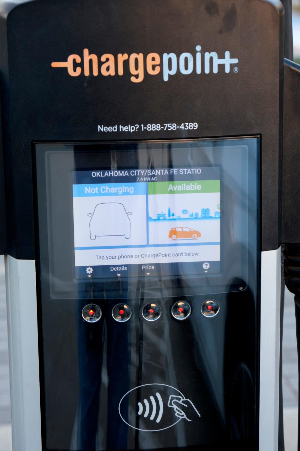 An electric vehicle uses a charging station Dec. 5 at Santa Fe Depot parking lot on E.K. Gaylord in downtown Oklahoma City.