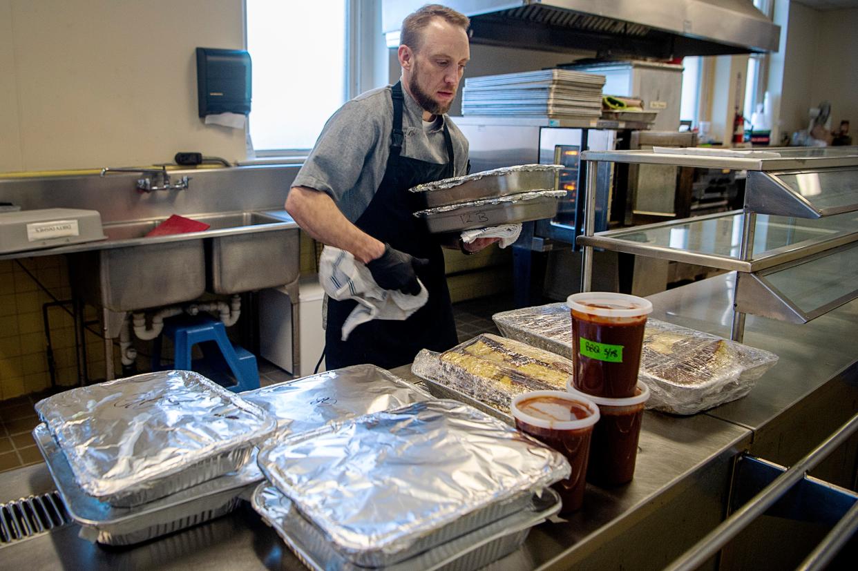 Chef Chad Holmes prepares to deliver meals to 12 Baskets Café March 20, 2023.