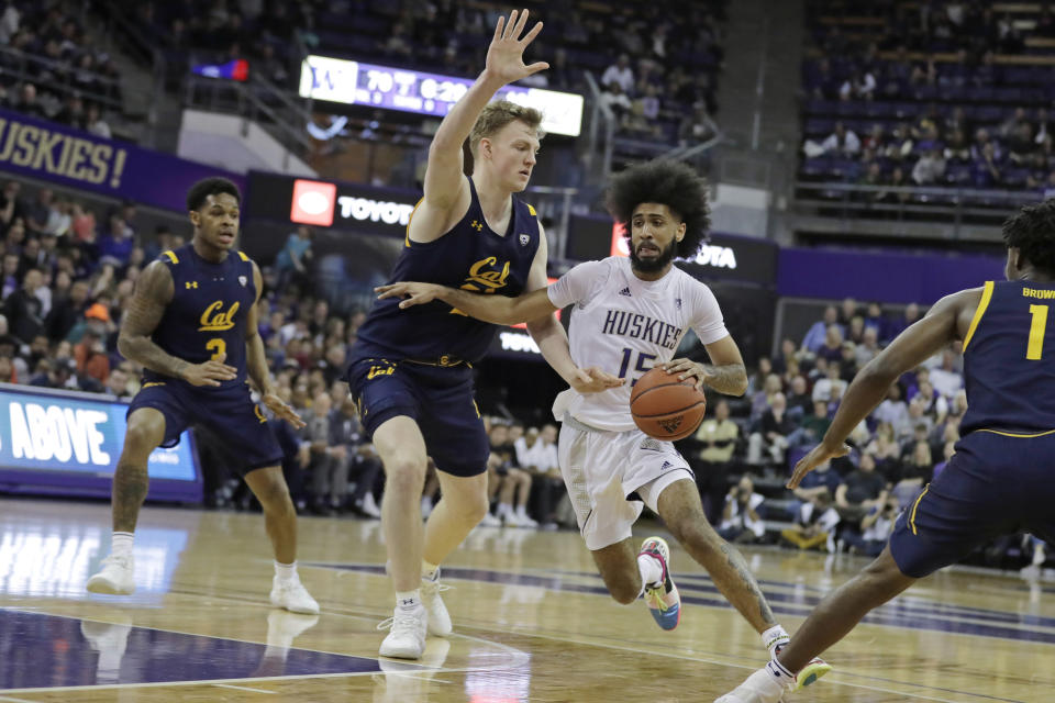 Washington guard Marcus Tsohonis (15) drives past California forward Lars Thiemann, second from left, during the second half of an NCAA college basketball game Saturday, Feb. 22, 2020, in Seattle. Washington won 87-52. (AP Photo/Ted S. Warren)