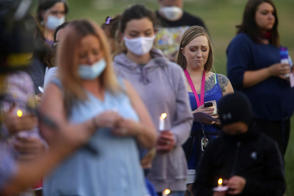 Visitors listen to "In the Arms of an Angel," during a memorial service for Tylee Ryan and Joshua "JJ" Vallow in Idaho Falls, Idaho, on June 12, 2020. A mother charged with murder in the deaths of her two children is set to stand trial in Idaho. The proceedings against Lori Vallow Daybell beginning Monday, April 3, 2023, could reveal new details in the strange, doomsday-focused case. (John Roark/The Idaho Post-Register via AP, File)