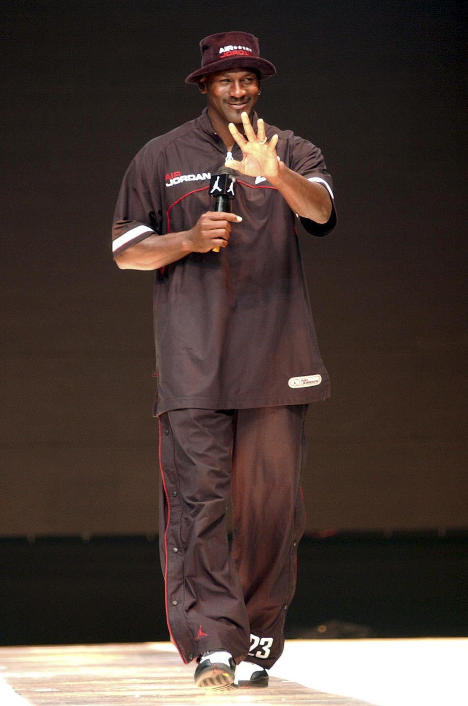 Michael Jordan waves to fans during an event to promote his brand-name sportswear, on May 22, 2004, in Taipei, Taiwan. (AP Photo/Jerome Favre)