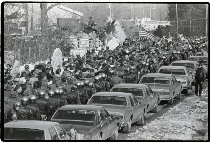 National Guard troops protect marchers in Cumming in 1987.
