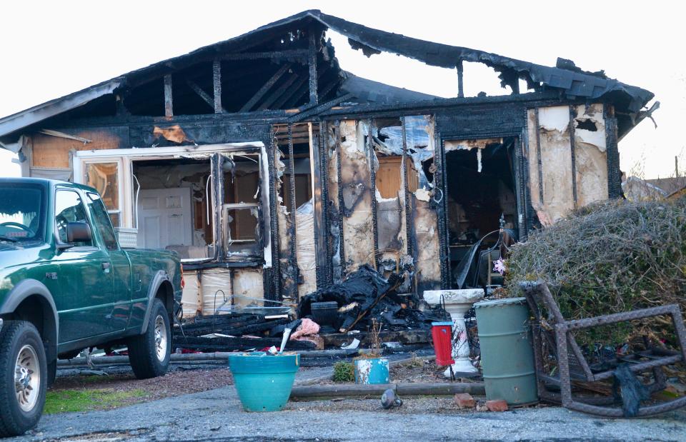 A fire Tuesday morning that destroyed this Wabash Avenue home was caused by improperly discarded smoking material, according to the Maryland Office of the State Fire Marshal.
