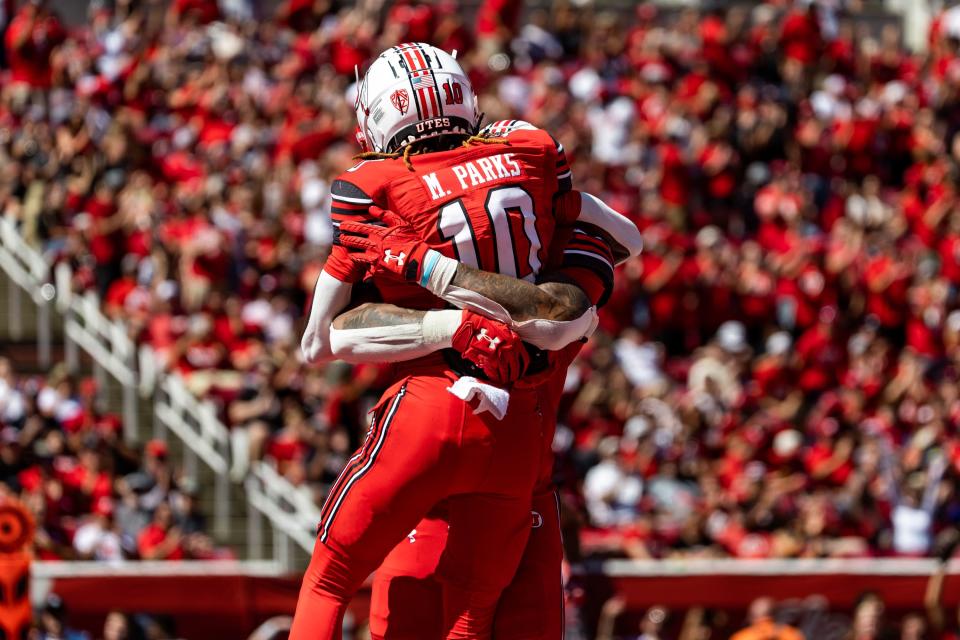 Utah Utes wide receiver Money Parks (10) and Utah Utes safety Ben Durham (30) celebrate Parks’ touchdown during the second quarter in the football game against the Weber State Wildcats at Rice-Eccles Stadium in Salt Lake City on Saturday, Sept. 16, 2023. | Megan Nielsen, Deseret News