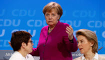 German Chancellor Angela Merkel walks past Annegret Kramp-Karrenbauer and Ursula von der Leyen during a Christian Democratic Union (CDU) party congress in Berlin, Germany, February 26, 2018. REUTERS/Fabrizio Bensch