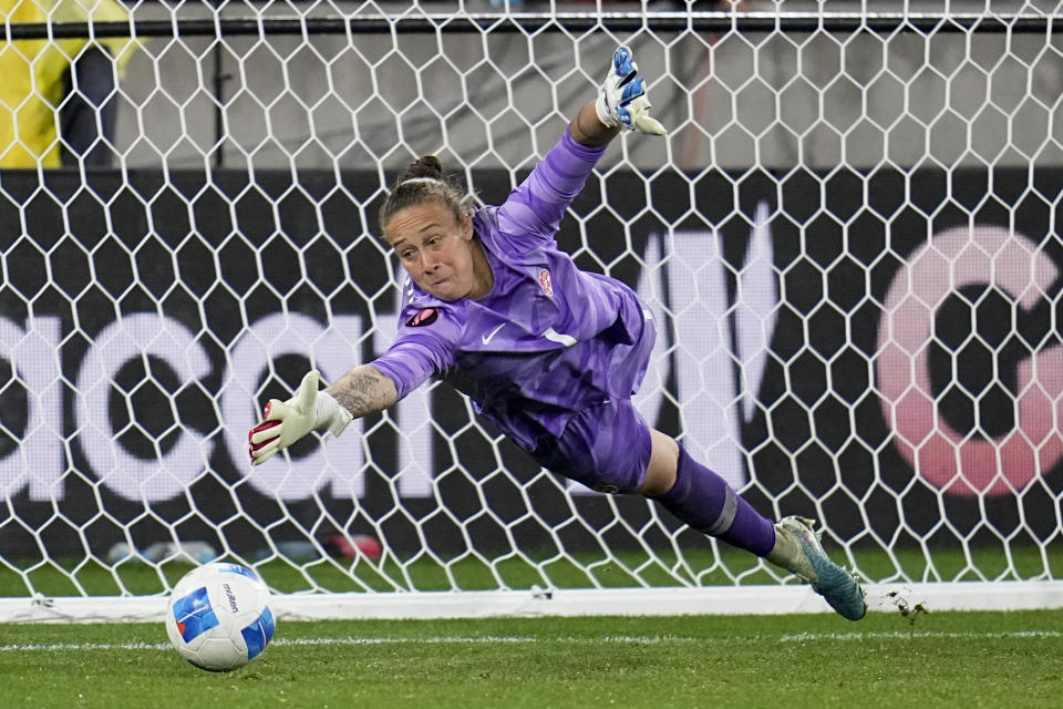 Canada goalkeeper Kailen Sheridan can't make the save in the penalty shootout of a CONCACAF Gold Cup women's soccer tournament semifinal match, Wednesday, March 6, 2024, in San Diego. (AP Photo/Gregory Bull)