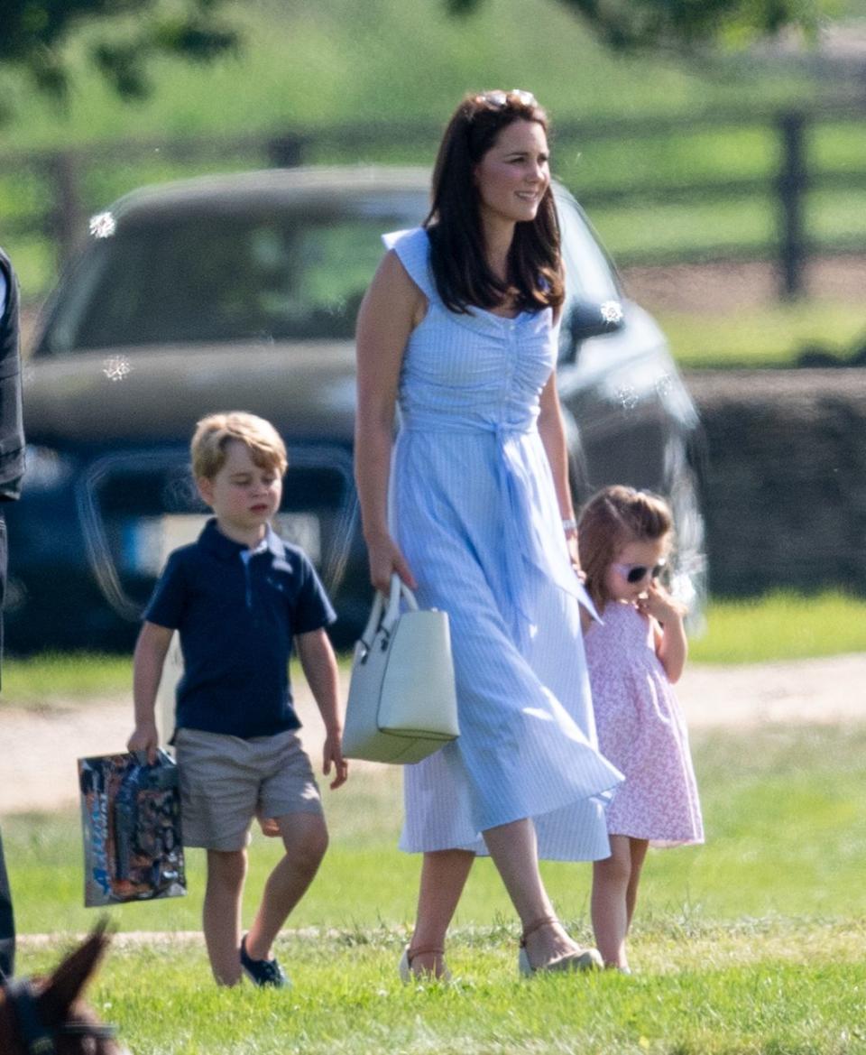 <p>Kate attends the <a rel="nofollow noopener" href="https://www.harpersbazaar.com/celebrity/latest/a21273985/kate-middleton-comforts-prince-george-polo-match/" target="_blank" data-ylk="slk:Maserati Royal Charity Polo Trophy;elm:context_link;itc:0;sec:content-canvas" class="link ">Maserati Royal Charity Polo Trophy</a> at Beaufort Park in Gloucester, England with children Prince George and Princess Charlotte. Prince William is playing polo, and the Cambridges are there to support him. </p>