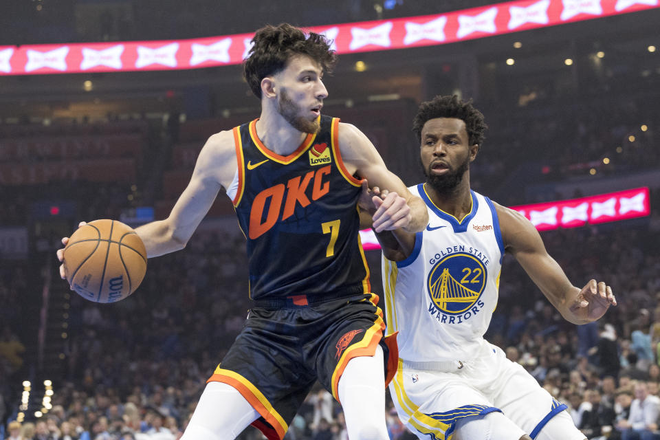 Nov 3, 2023; Oklahoma City, Oklahoma, USA; Oklahoma City Thunder forward Chet Holmgren (7) drives to the basket against Golden State Warriors forward Andrew Wiggins (22) during the first quarter at Paycom Center. Mandatory Credit: Alonzo Adams-USA TODAY Sports