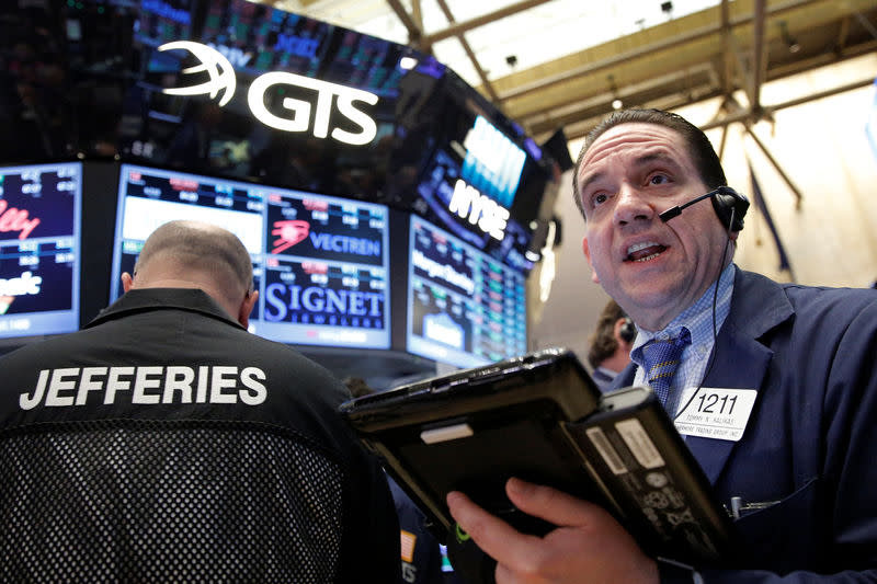 Traders work on the floor of the New York Stock Exchange (NYSE) in New York City, U.S., December 9, 2016. REUTERS/Brendan McDermid