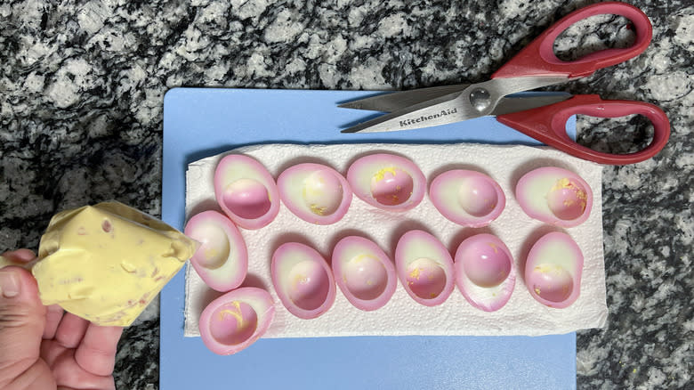 hand with hard-boiled eggs