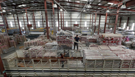 An employee works inside Akkad's carpet factory in Jordan Industrial Estates Company in Al-Muwaqar south of Amman, Jordan, September 14, 2017. Picture taken September 14, 2017. REUTERS/Muhammad Hamed