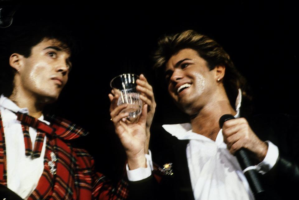 UNITED KINGDOM - DECEMBER 01:  WEMBLEY ARENA  Photo of George MICHAEL and Andrew RIDGELEY and WHAM!, L-R: Andrew Ridgeley, George Michael  (Photo by Gabor Scott/Redferns)