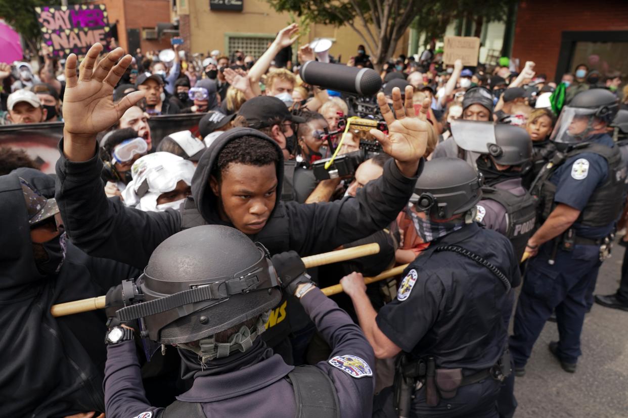 Angry clashes between police and protesters broke out in Louisville on Wednesday night (Copyright 2020 The Associated Press. All rights reserved)