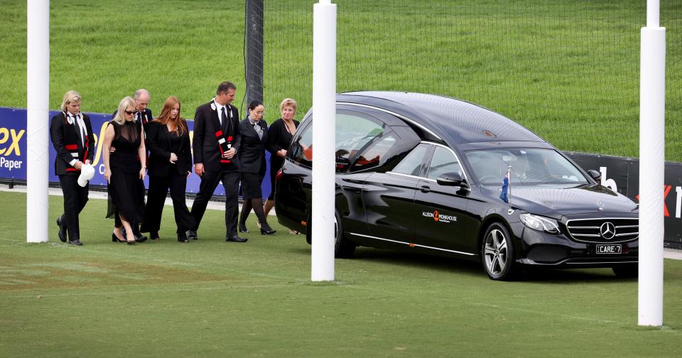 Shane Warne's family, pictured here following the hearse on a lap of the ground.