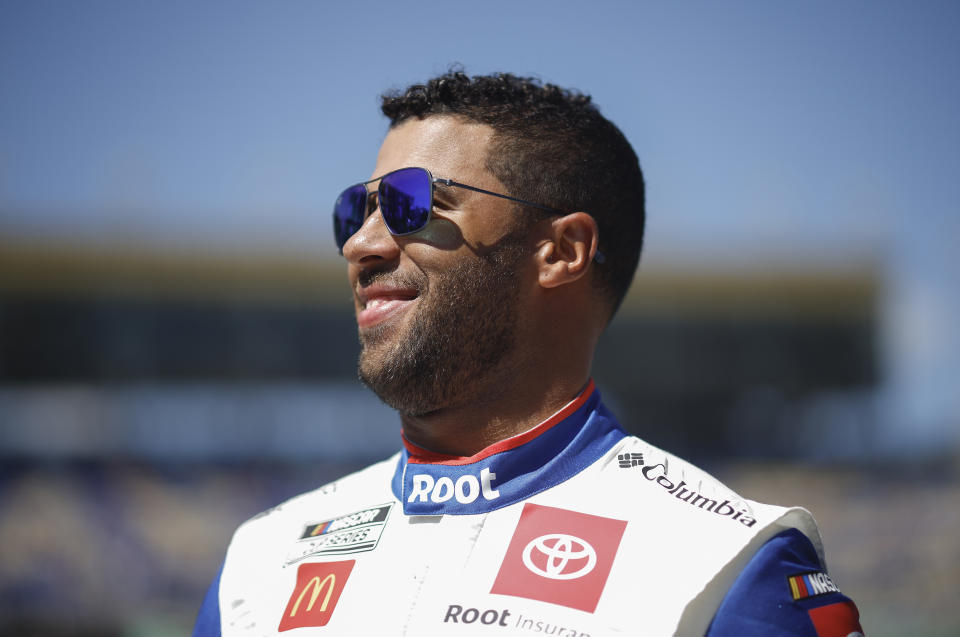 KANSAS CITY, KANSAS - SEPTEMBER 11: Bubba Wallace, driver of the #45 ROOT Insurance Toyota, waits on the grid prior to the NASCAR Cup Series Hollywood Casino 400 at Kansas Speedway on September 11, 2022 in Kansas City, Kansas. (Photo by Chris Graythen/Getty Images)