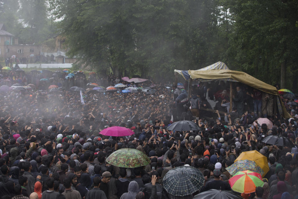 Kashmiri villagers display the body of Zakir Musa, a top militant commander linked to al-Qaida, as it rains during his funeral procession in Tral, south of Srinagar, Indian controlled Kashmir, Friday, May 24, 2019. Musa was killed Thursday evening in a gunfight after police and soldiers launched a counterinsurgency operation in the southern Tral area, said Col. Rajesh Kalia, an Indian army spokesman. (AP Photo/Dar Yasin)