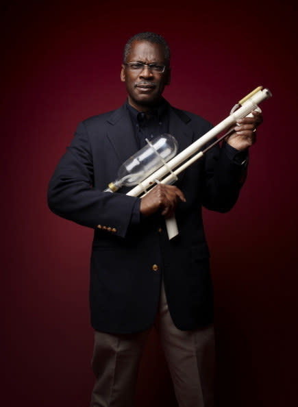 Lonnie Johnson holding the super soaker prototype