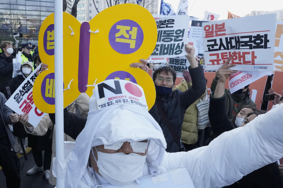 Protesters shout slogans during a rally against the South Korean government's move to improve relations with Japan, in front of the Japanese Embassy in Seoul, South Korea, Wednesday, March 1, 2023. South Korea's president on Wednesday called Japan "a partner that shares the same universal values" and renewed hopes to repair ties frayed over Japan's colonial rule of the Korean Peninsula. (AP Photo/Ahn Young-joon)