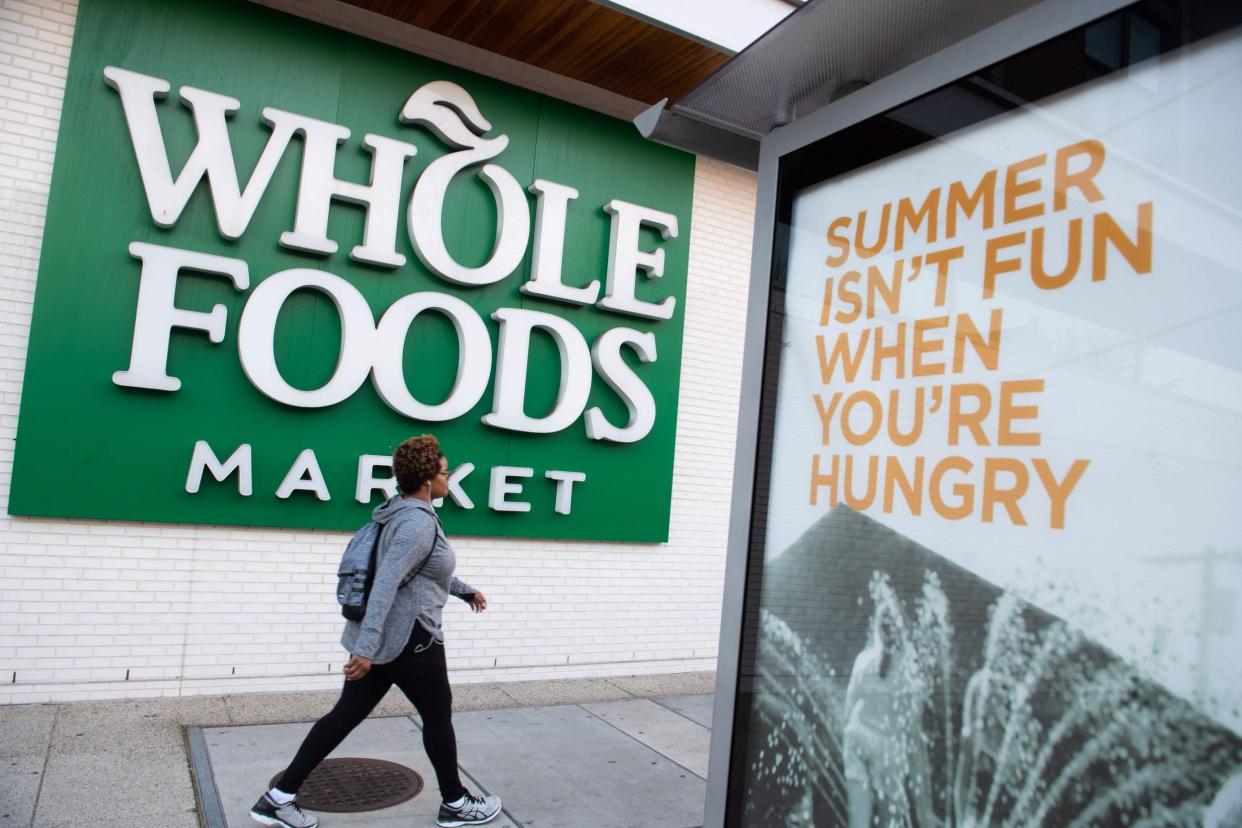 Whole Foods workers are under pressure from surging demand as Americans stay at home: AFP via Getty Images
