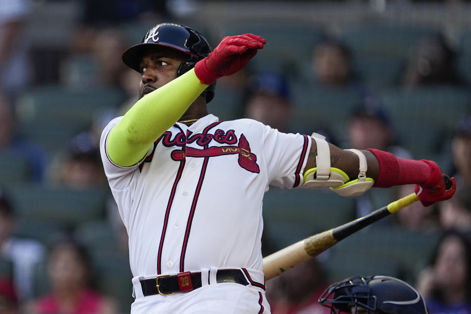Atlanta Braves designated hitter Marcell Ozuna hits a solo home run in the ninth inning of a baseball game against the Washington Nationals, Sunday, Oct. 1, 2023, in Atlanta. (AP Photo/John Bazemore)