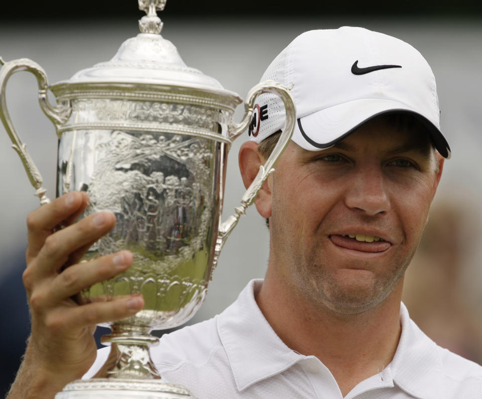 FILE - In this June 22, 2009, file photo, Lucas Glover holds his trophy after winning the U.S. Open Golf Championship at Bethpage State Park's Black Course in Farmingdale, N.Y. Glover is the last qualifier to win the U.S. Open. The USGA announced exemption categories Thursday, June 25, 2020, because the COVID-19 pandemic eliminated any chance of holding qualifiers across the country. (AP Photo/Charles Krupa, File)