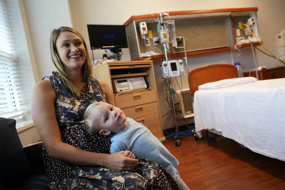 Lacy Kee holds her son, Walt, 2, in a birthing room at the Henry County Medical Center in Paris, Tenn., on Tuesday, Aug. 29, 2023. With the closing of the obstetrics unit, Kee, who gave birth to Walt at the facility, said she’ll have to drive 45 minutes and cross the state line into Kentucky to give birth to her third child in early October. She’s especially concerned because she has gestational diabetes and recently had a scare with her fetus’ heart rate. (AP Photo/Mark Humphrey)