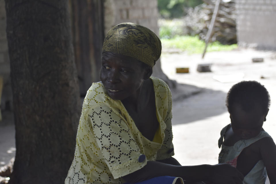 Josephine Noubarangal, a mother of six children, who suffered from violence is photographed outside her house in Binmar, Chad, Friday, July 19, 2024. (AP Photo/Robert Bociaga)