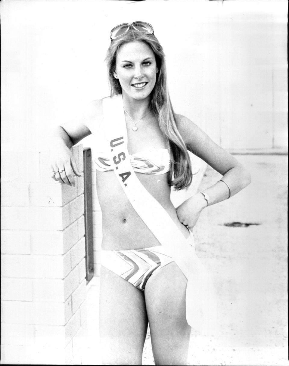 Miss USA 1979 Mary Therese Friel poses in her sash and a swimsuit.