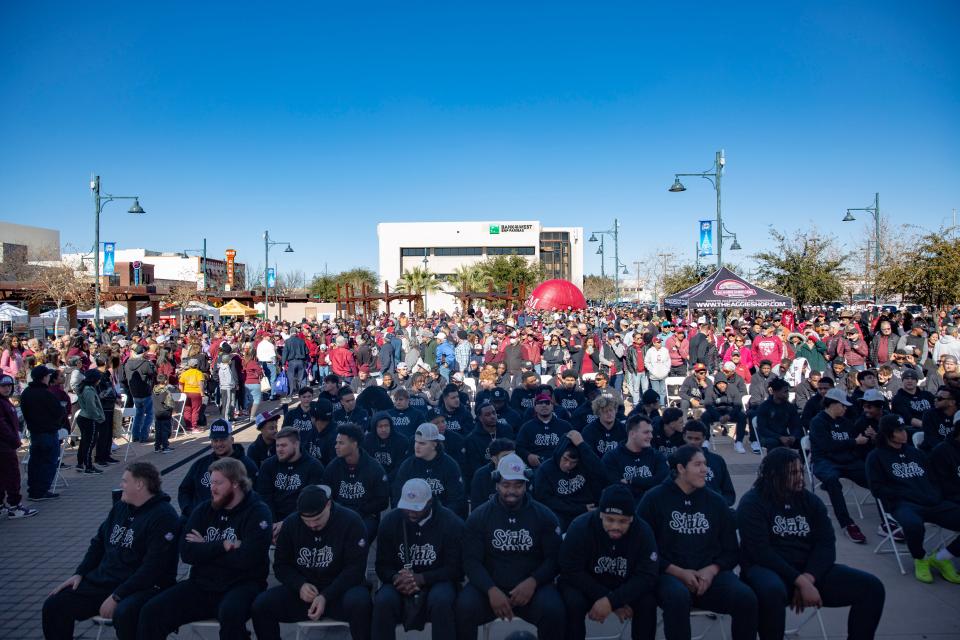 The NMSU football team are welcomed by hundreds of fans during the Quick Lane Bowl Celebration on Saturday, Jan. 21, 2023, at the downtown plaza in Las Cruces. 