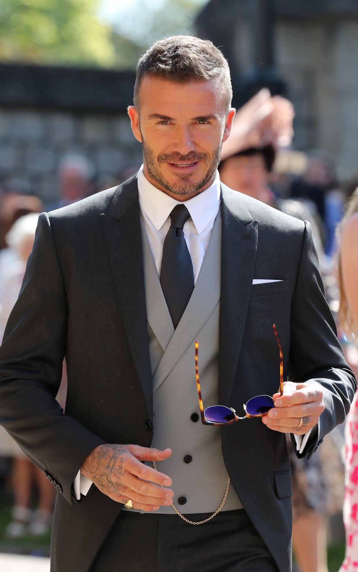 David Beckham in Dior Man, attending the wedding of Prince Harry and Meghan Markle in May - PA