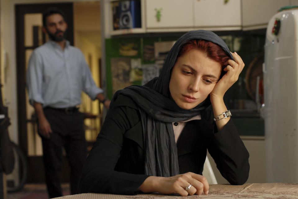 FILE - In this undated file photo released by Filmiran film distributing company, Iranian actress Leila Hatami, and actor Peyman Moadi, act in a scene of movie "A Separation" which won the Academy Awards in foreign films. Iranian authorities canceled a ceremony Monday in honor of the country's Oscar-winning director even though the government had hailed his win as a triumph over a competitor from Israel. There were no details as to why a permit was denied but some Iranian conservatives were upset with the film's themes: domestic turmoil, gender inequality and the desire by many to leave the country. (AP Photo/Filmiran International Company, Habib Majidi, File)