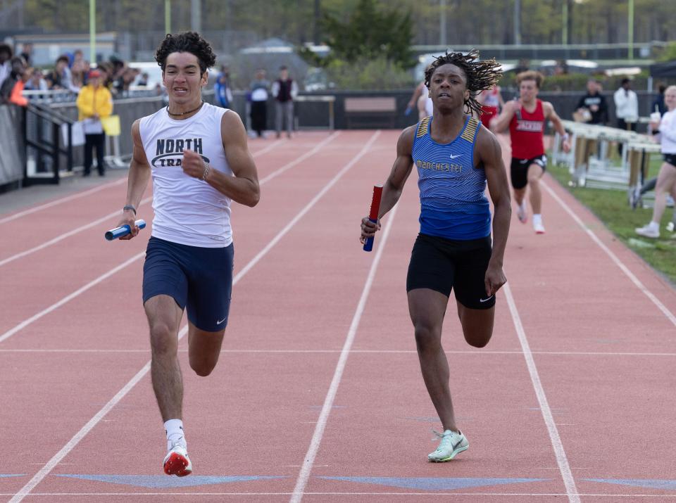 Jacob Kiyler (left) runs anchor leg on Toms River North' winning 4X200. Ocean County Track and Field Relays in Stafford Township on May 5, 2023.