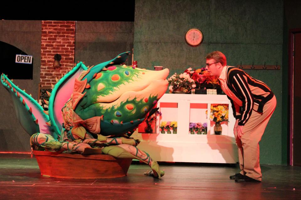 Bryan Songy, left, and Kit Asfeldt rehearse a scene from the Four Corners Musical Theatre Company production of "Little Shop of Horrors."