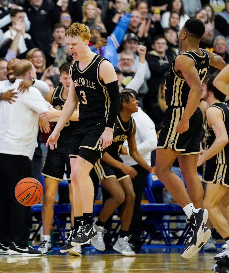 Noblesville Millers guard Aaron Fine (3) yells in excitement after defeating Zionsville Eagles for the IHSAA Class 4A sectional championship on Saturday, March 4, 2023 at Carmel High School in Carmel. The Noblesville Millers defeated the Zionsville Eagles, 58-50. 