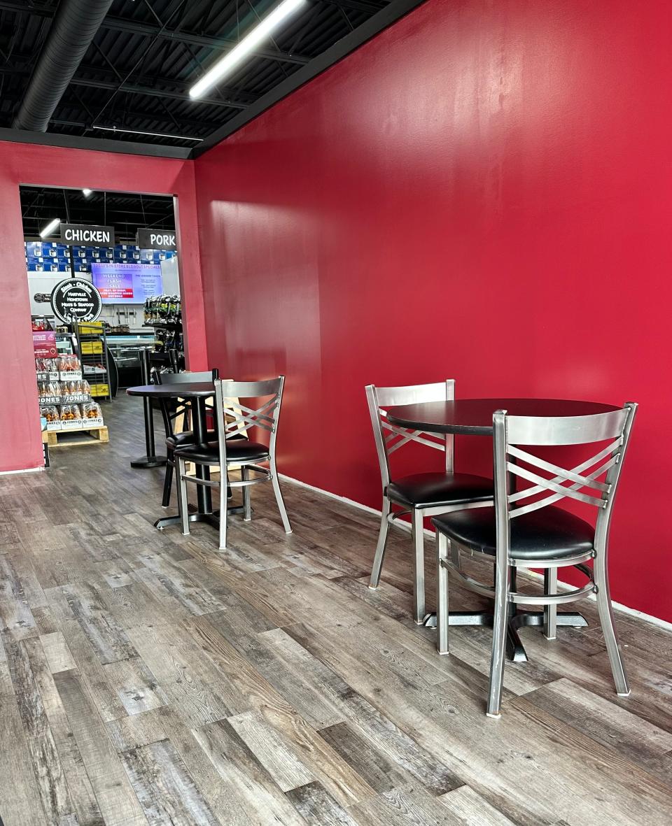 A cozy and clean seating area nestled between The Blazing Pig and Hartville Meats and Seafood in Jackson Township.