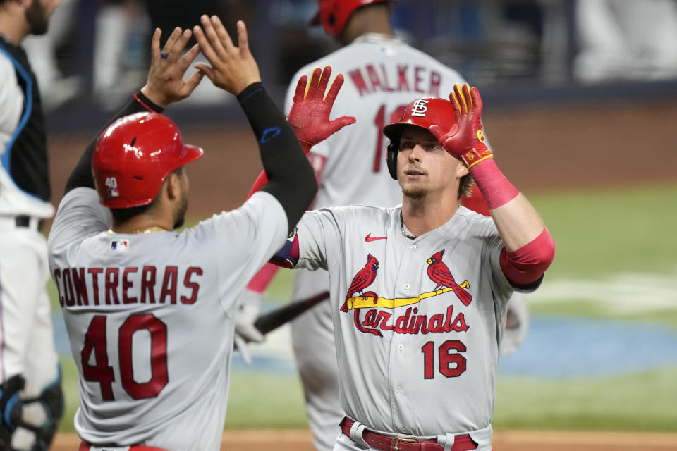 St. Louis Cardinals' Nolan Gorman (16) is met by Willson Contreras (40) after hitting a two-run home run against the Miami Marlins during the third inning of a baseball game Wednesday, July 5, 2023, in Miami. (AP Photo/Lynne Sladky)