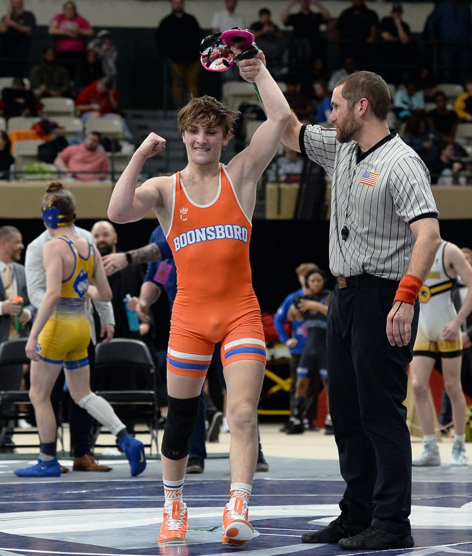 Boonsboro's Tanner Halling has his arm raised in victory after topping Northern Garrett's Devon Opel 8-4 in the Class 2A-1A state final at 126 pounds.