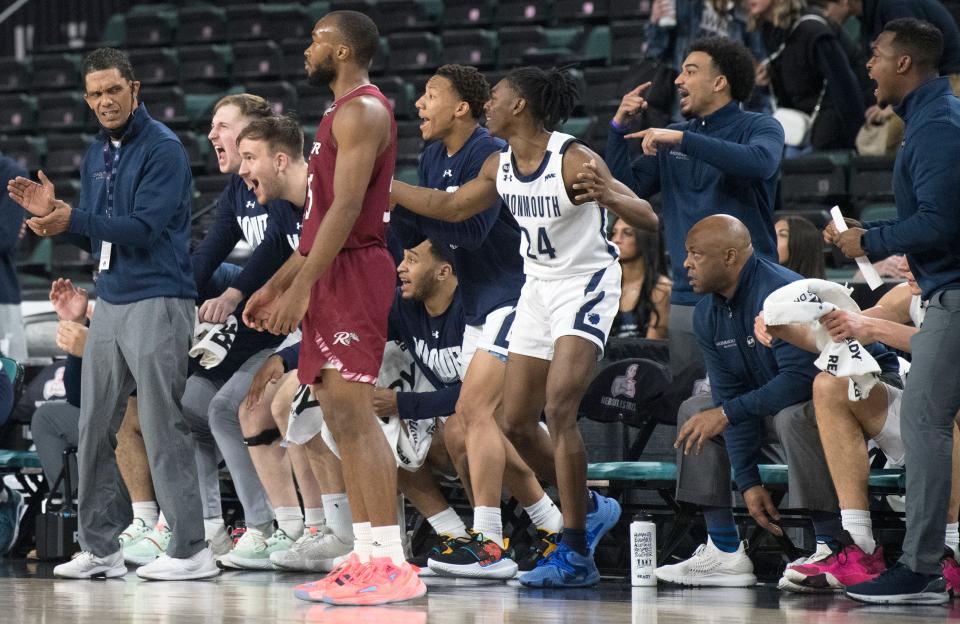 Monmouth men's basketball coach King Rice, left, and his players react after a play during the semifinal game of the MAAC Tournament between Monmouth and Rider played at Jim Whelan Boardwalk Hall in Atlantic City on Friday, March 11, 2022.    Monmouth defeated Rider, 72-68.
