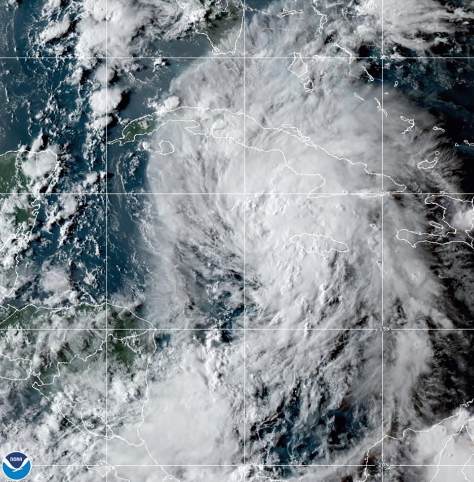 This GOES-16 East GeoColor satellite image taken Thursday, Aug. 26, 2021, at 10:20 p.m. EDT, and provided by NOAA, shows Tropical Storm Ida in the Caribbean Sea. Tropical Storm Ida formed in the Caribbean on Thursday and forecasters said its track was aimed at the U.S. Gulf Coast, prompting Louisiana's governor to declare a state of emergency and forecasters to announce a hurricane watch for New Orleans. (NOAA via AP)