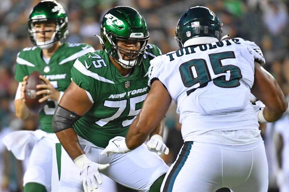 Aug 12, 2022; Philadelphia, Pennsylvania, USA; New York Jets guard Alijah Vera-Tucker (75) blocks Philadelphia Eagles defensive tackle Marlon Tuipulotu (95) at Lincoln Financial Field. Mandatory Credit: Eric Hartline-USA TODAY Sports