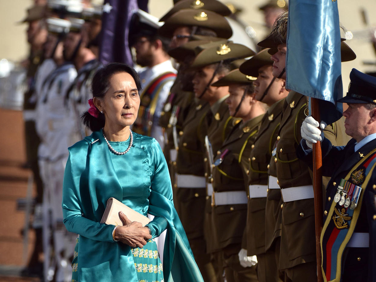 Aung San Suu Kyi arrives in Canberra to be met by a military honour guard and Australia's Prime Minister, Malcolm Turnbull: Getty