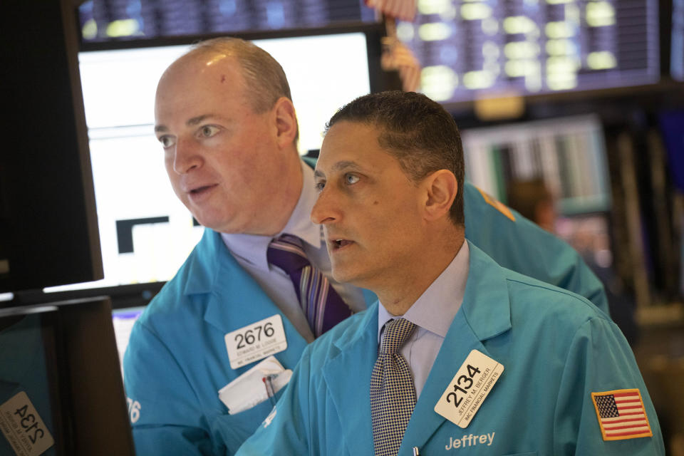Edward Loggie, left, and Jeffrey Berger work at the New York Stock Exchange, Monday, Sept. 16, 2019. Global stock markets sank Monday after crude prices surged following an attack on Saudi Arabia's biggest oil processing facility. (AP Photo/Mark Lennihan)