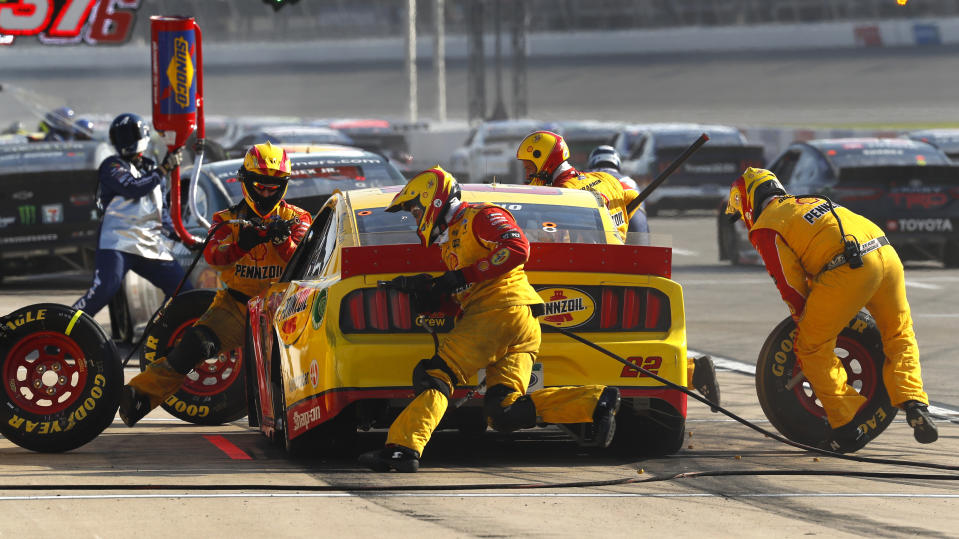 Joey Logano makes a pit stop during a NASCAR Cup Series auto race at Michigan International Speedway in Brooklyn, Mich., Sunday, Aug. 9, 2020. (AP Photo/Paul Sancya)