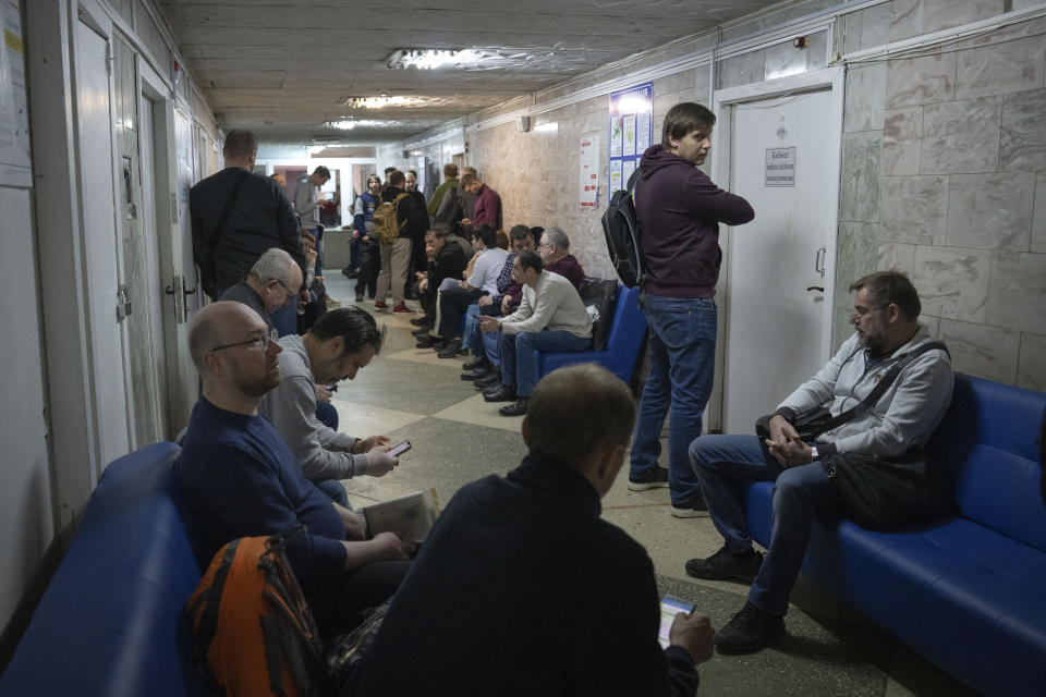 Recruits wait for their turn to pass medical examination in a city hospital in Kyiv, Ukraine, Thursday, Feb. 8, 2024. As the third year of war begins, the most sensitive and urgent challenge pressing on Ukraine is whether it can muster enough new soldiers to repel – and eventually drive out – an enemy with far more fighters at its disposal. (AP Photo/Efrem Lukatsky)