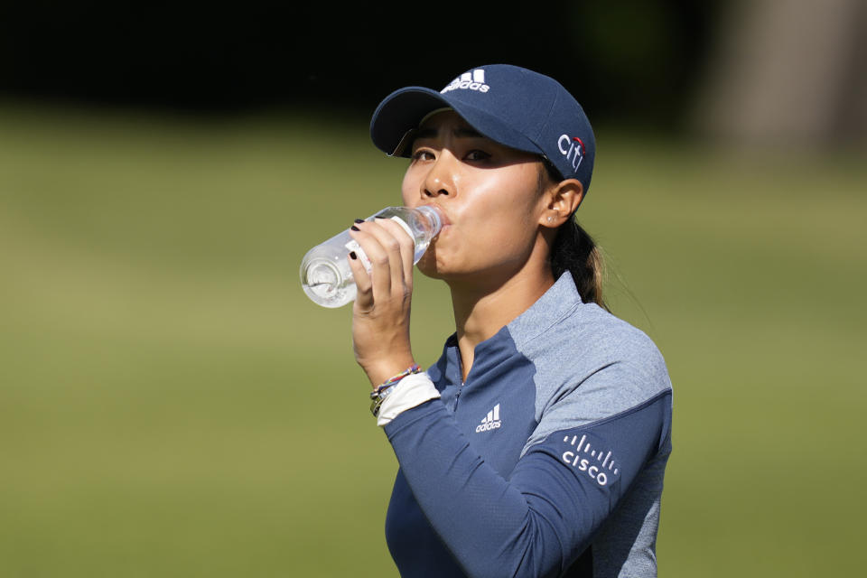 Danielle Kang of the United States drinks on the fourth hole during the third round of the BMW Ladies Championship at LPGA International Busan in Busan, South Korea, Saturday, Oct. 23, 2021. (AP Photo/Lee Jin-man)