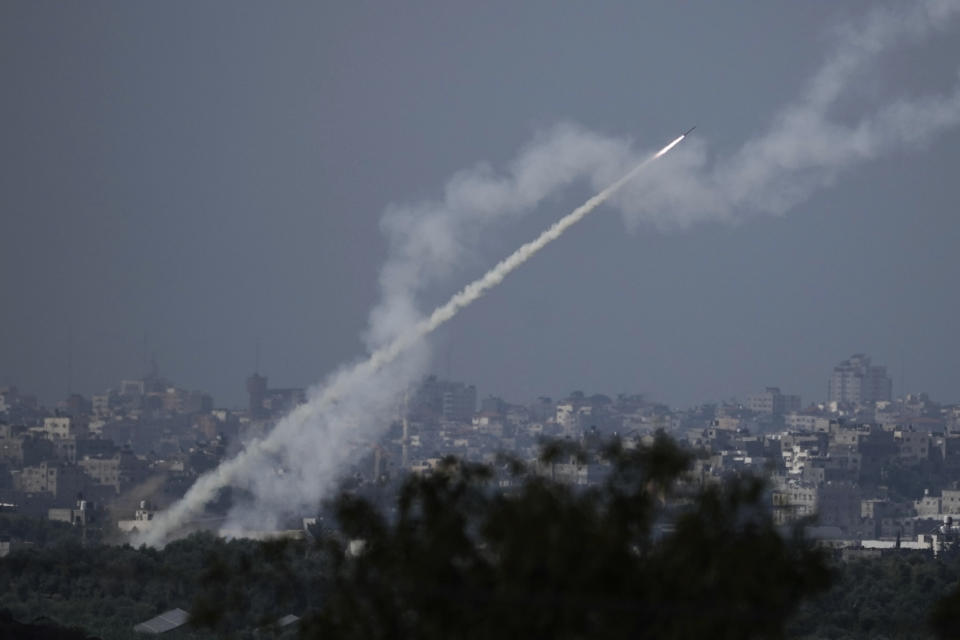 Rockets are fired toward Israel from the Gaza Strip, as seen from southern Israel, Monday, Oct. 16, 2023. (AP Photo/Leo Correa)